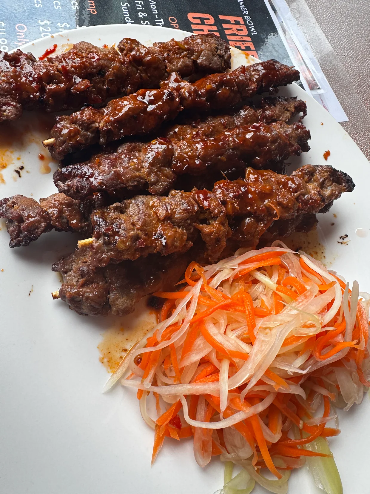 Glazed Cambodian beef skewers with pickled papaya